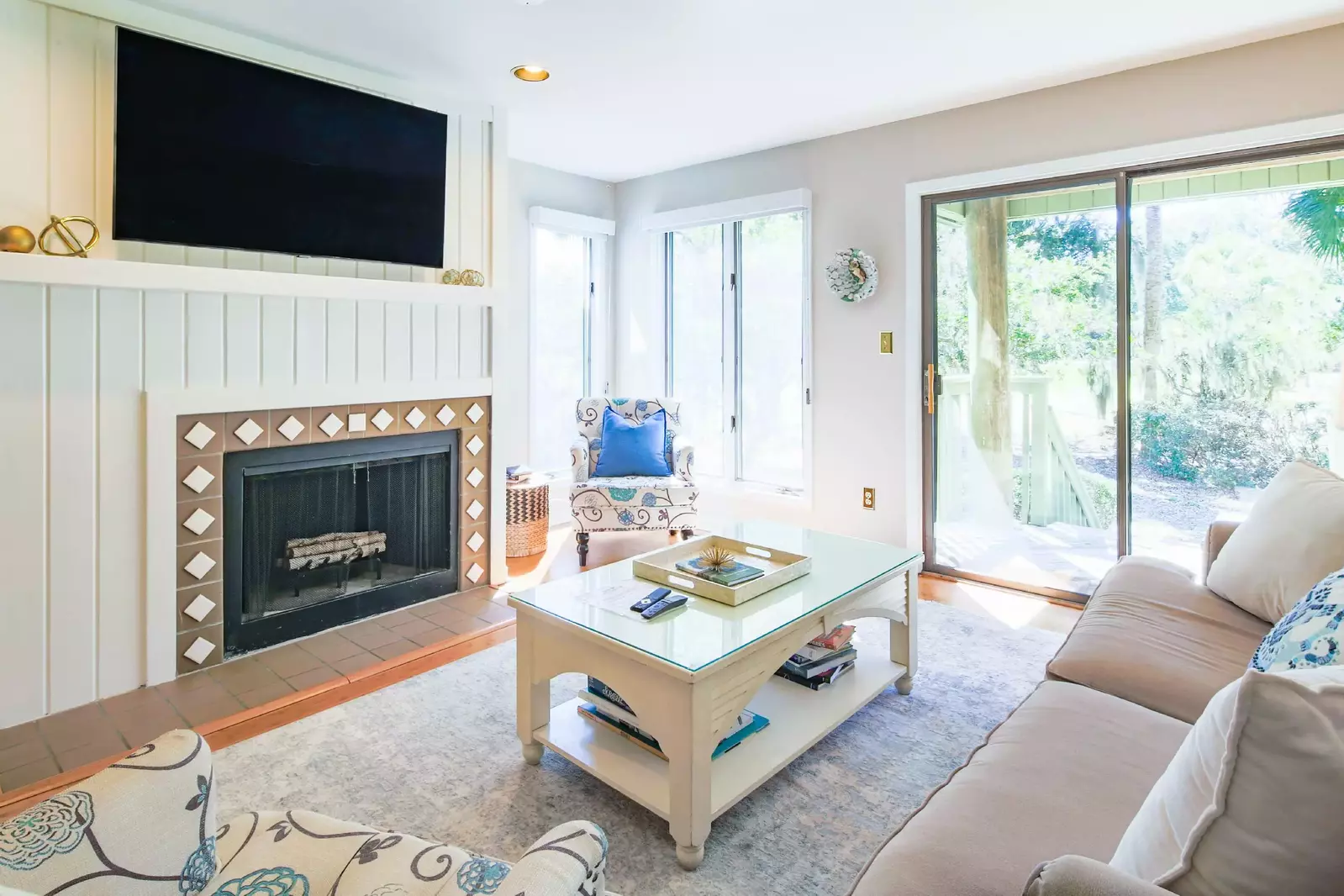 The Parkside living room features a comfortable seating area, a streaming TV and access to the porch.
