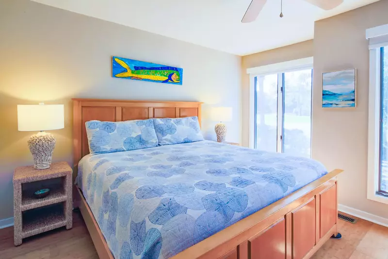 The master suite looks out onto Night Heron Park.