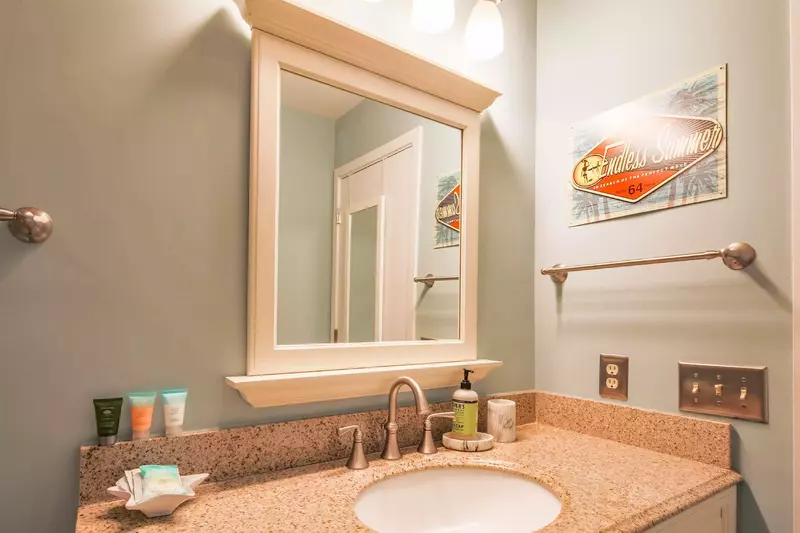 The hallway bathroom features a spacious vanity.