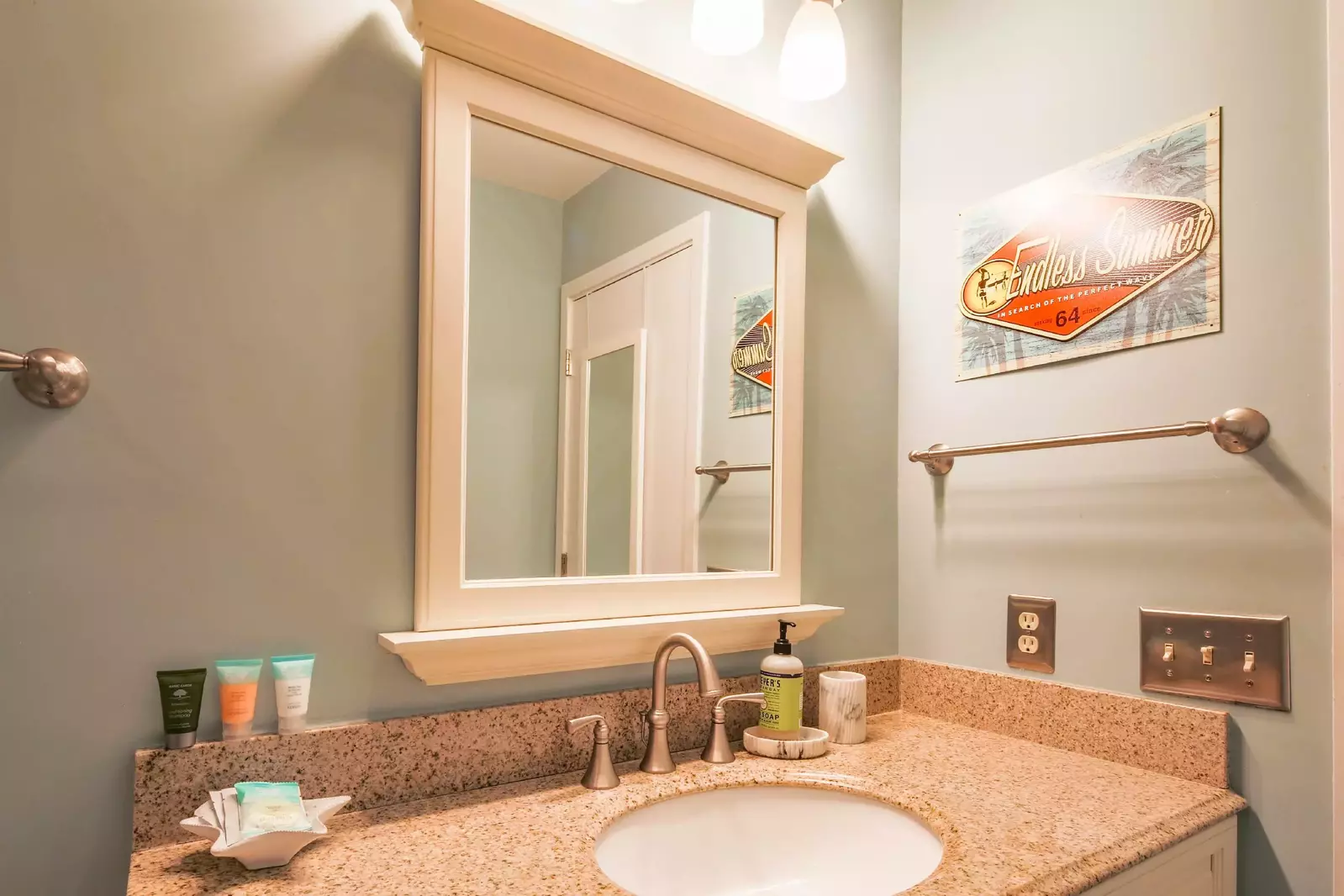 The hallway bathroom features a spacious vanity.