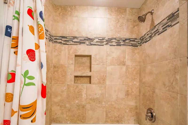 This bathroom has a shower/tub combo.