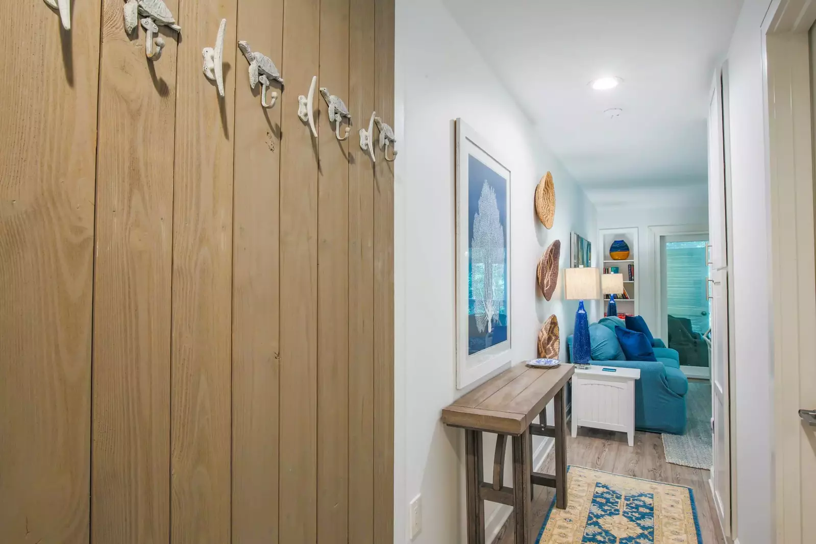 When you enter the home, you'll find this hallway that connects you to the bedroom, living room and kitchen.