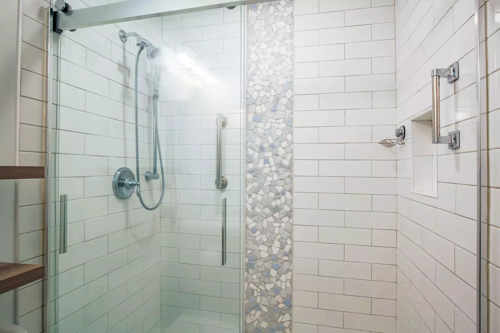 The bathroom also has this beautifully tiled, walk-in shower.