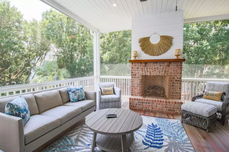 Relax on our inviting & comfortable screened porch with views of the surrounding oak trees and private pool below.