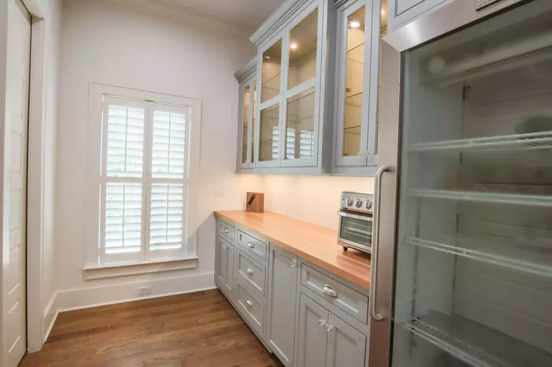 This fabulous pantry includes an additional refrigerator, toaster oven and glassware.