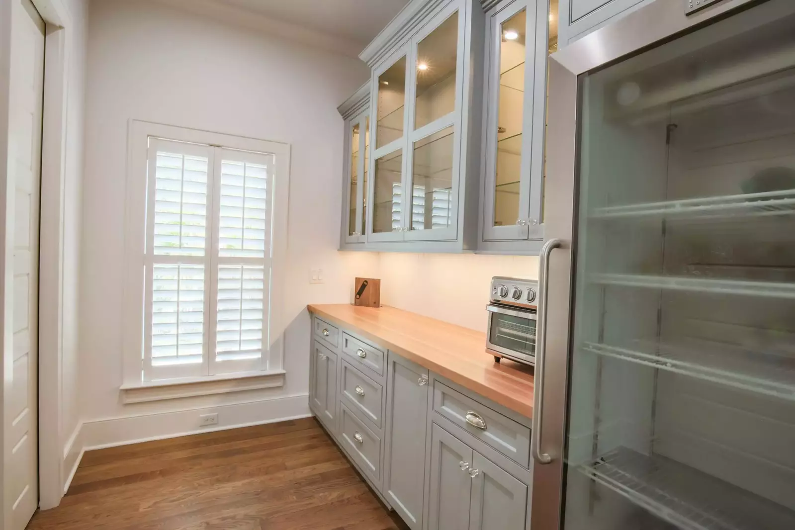 This fabulous pantry includes an additional refrigerator, toaster oven and glassware.