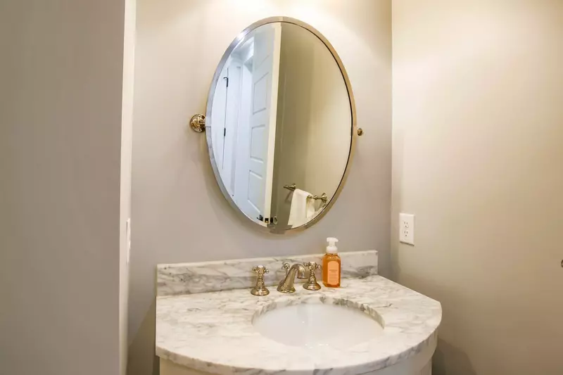 You'll find this half bathroom in between the kitchen and master suite.