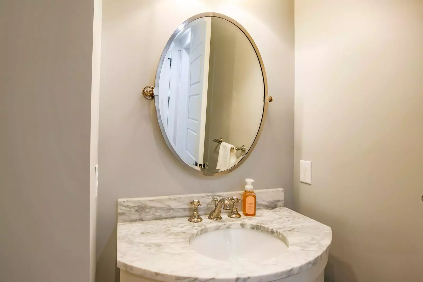 You'll find this half bathroom in between the kitchen and master suite.
