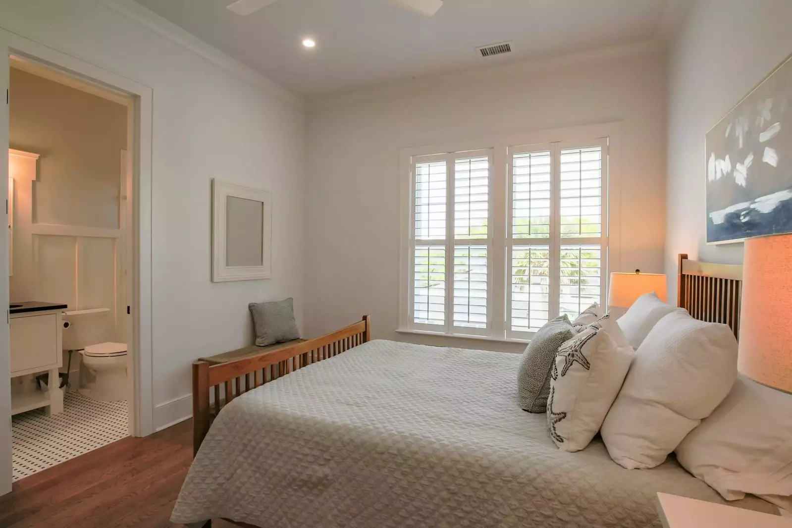 This guest bedroom also features an en suite bathroom.