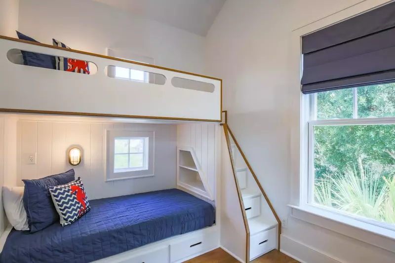 The built-in bunk beds feature their own light and storage areas.