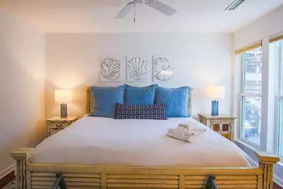 The home is decorated in a comfortable, coastal decor with a mix of blues, yellows and beiges.