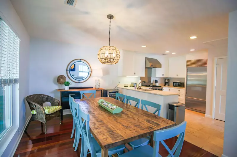 The dining room opens onto both the kitchen and the living room areas.