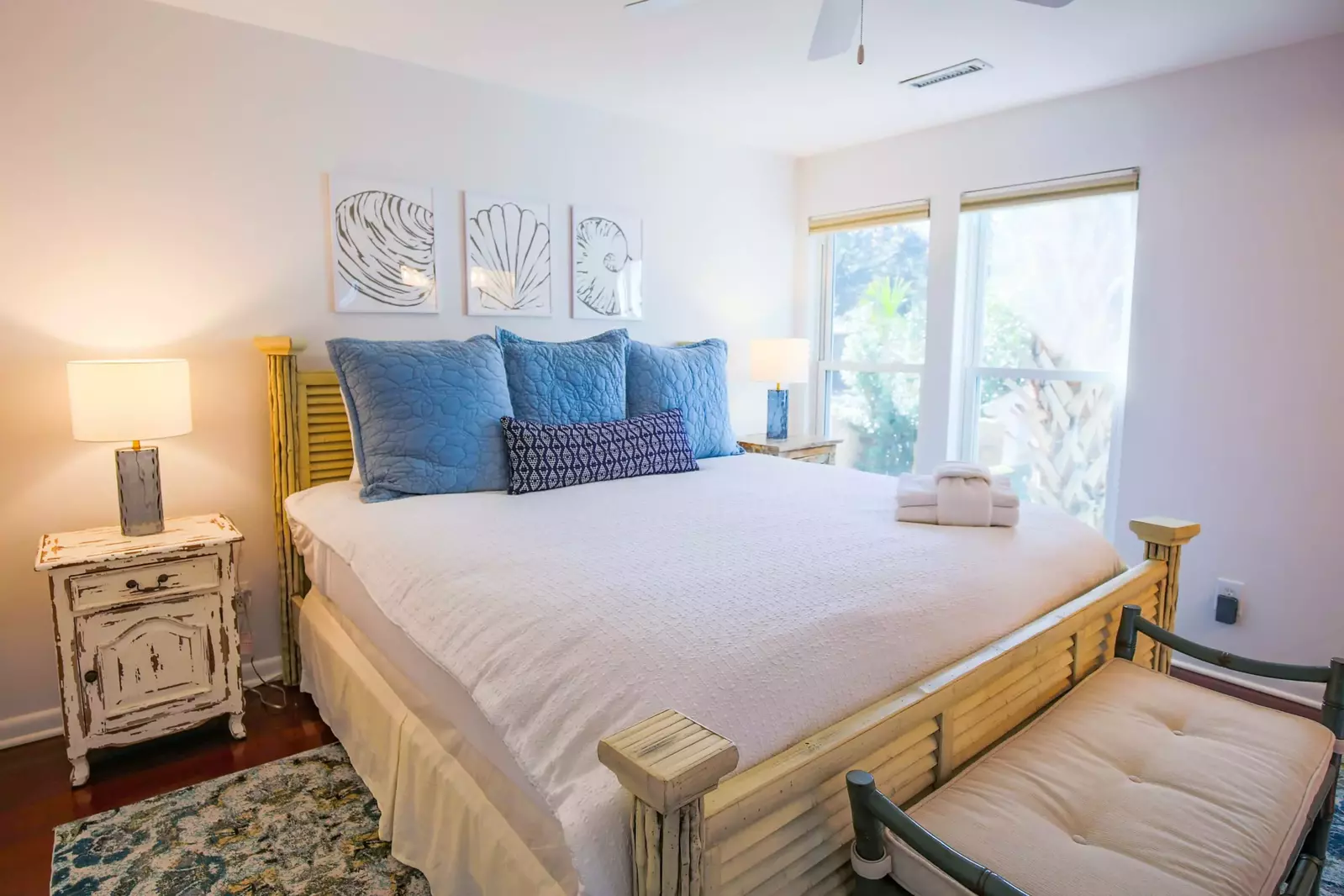 This guest bedroom features a king bed and night stands with reading lamps.