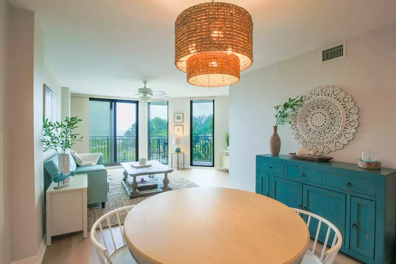 The dining table seats 4 and there are 3 additional stools at the kitchen counter.