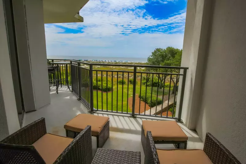 Step out of the master suite to find this stunning view and this seating area on the covered balcony.