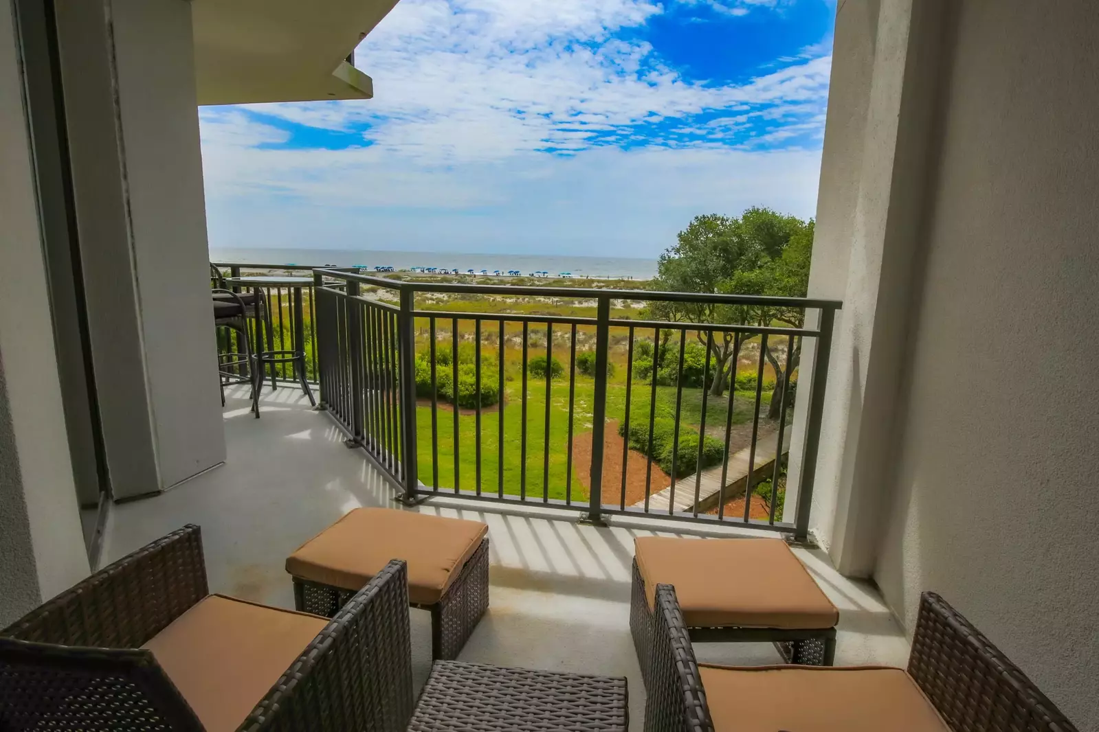 Step out of the master suite to find this stunning view and this seating area on the covered balcony.