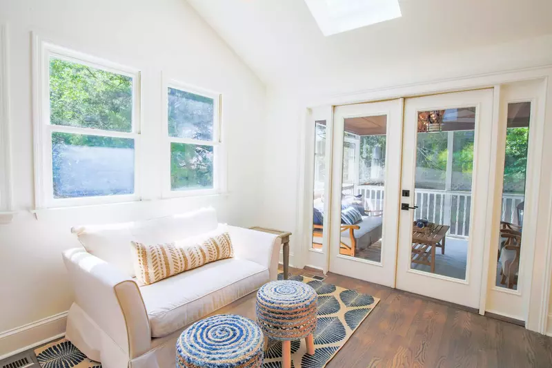 This seating area near the banquette dining table looks out onto the screened porch.