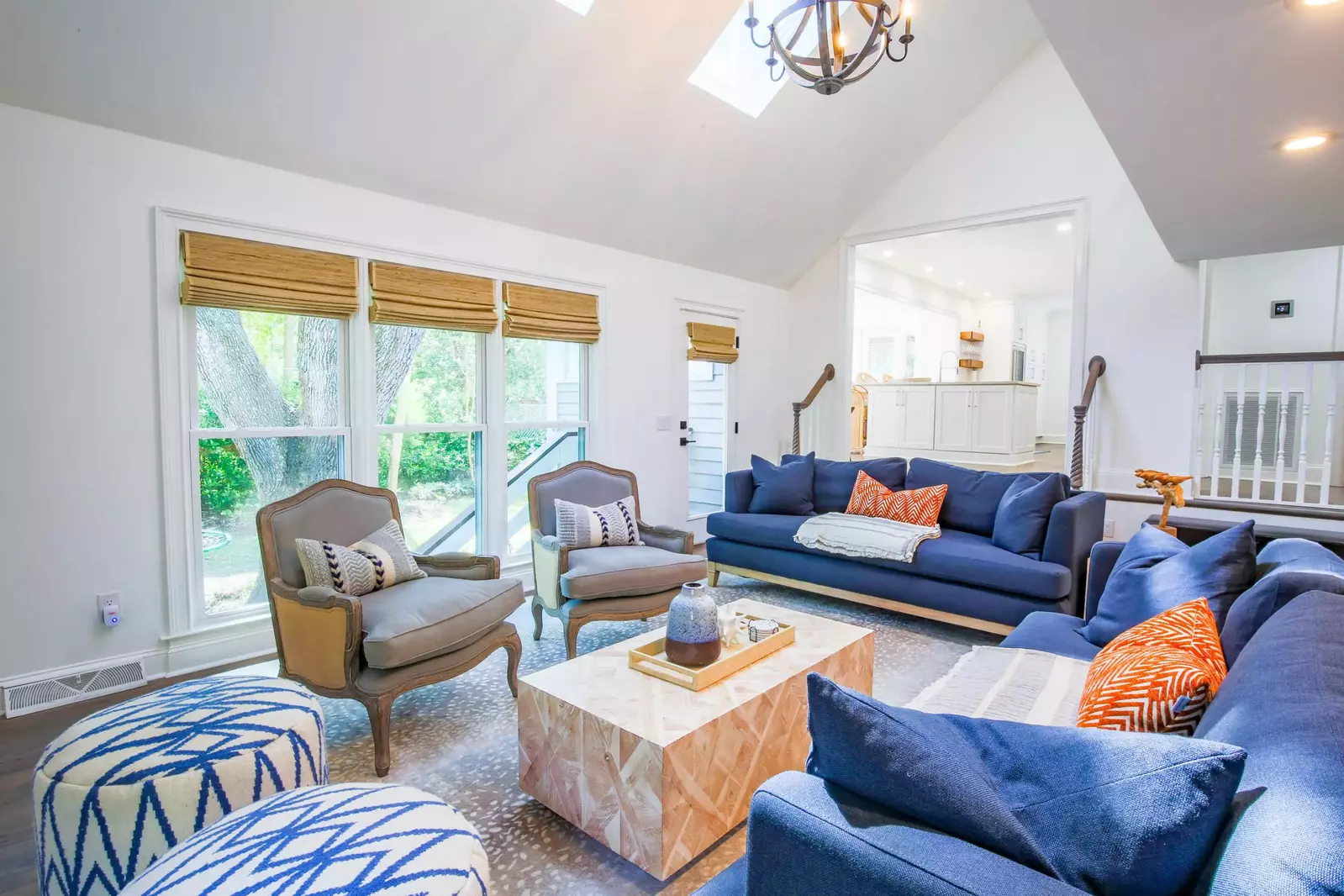 The living room features cathedral ceilings and a large, comfortable seating area.