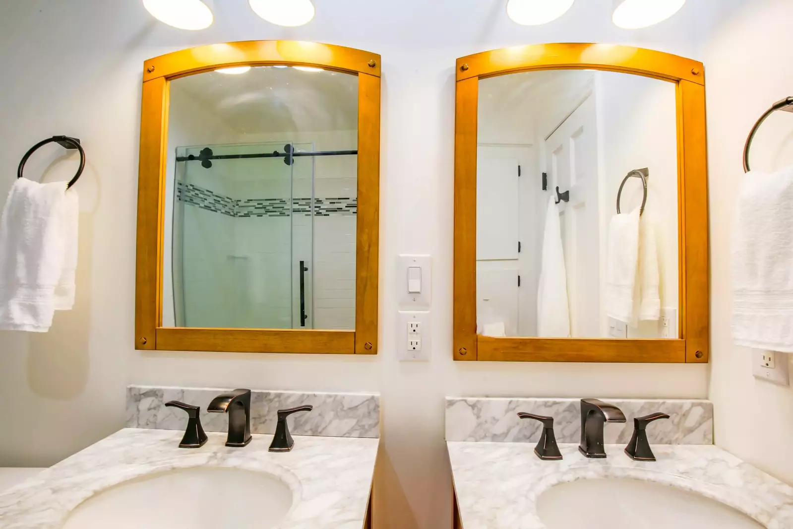 The en suite bathroom for the second master suite has two vanities.