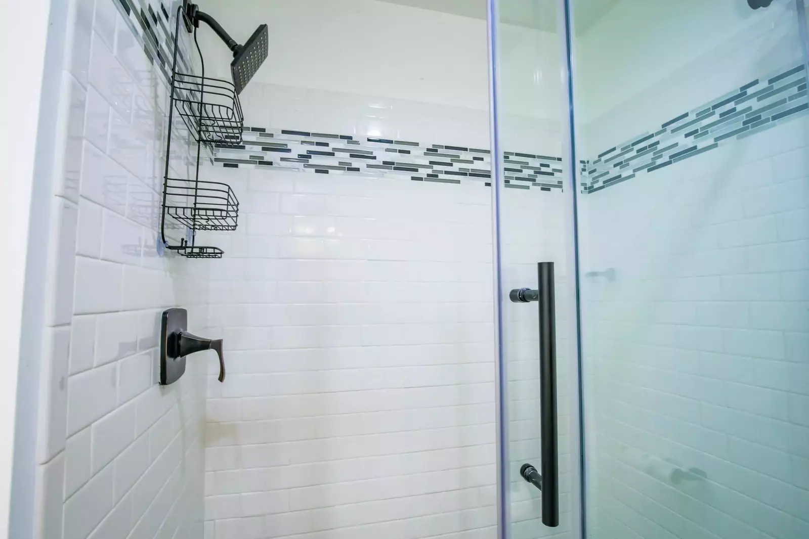 The en suite bathroom also features a tiled, walk-in shower.