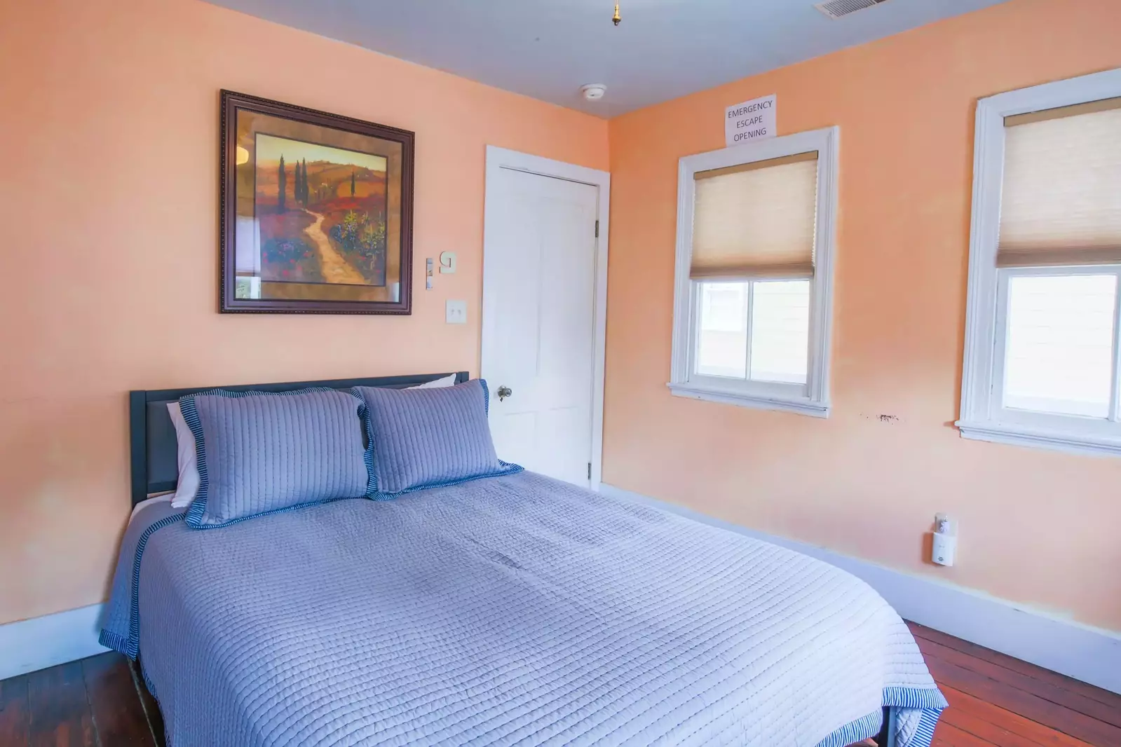The stairwell to the home's second bathroom is located just outside of this door.