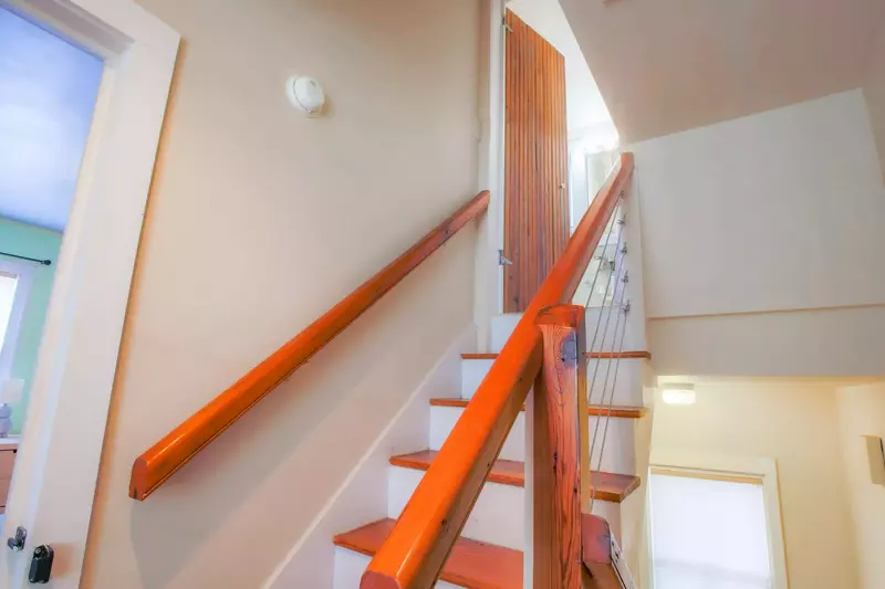 Follow this staircase to the home's second bathroom.