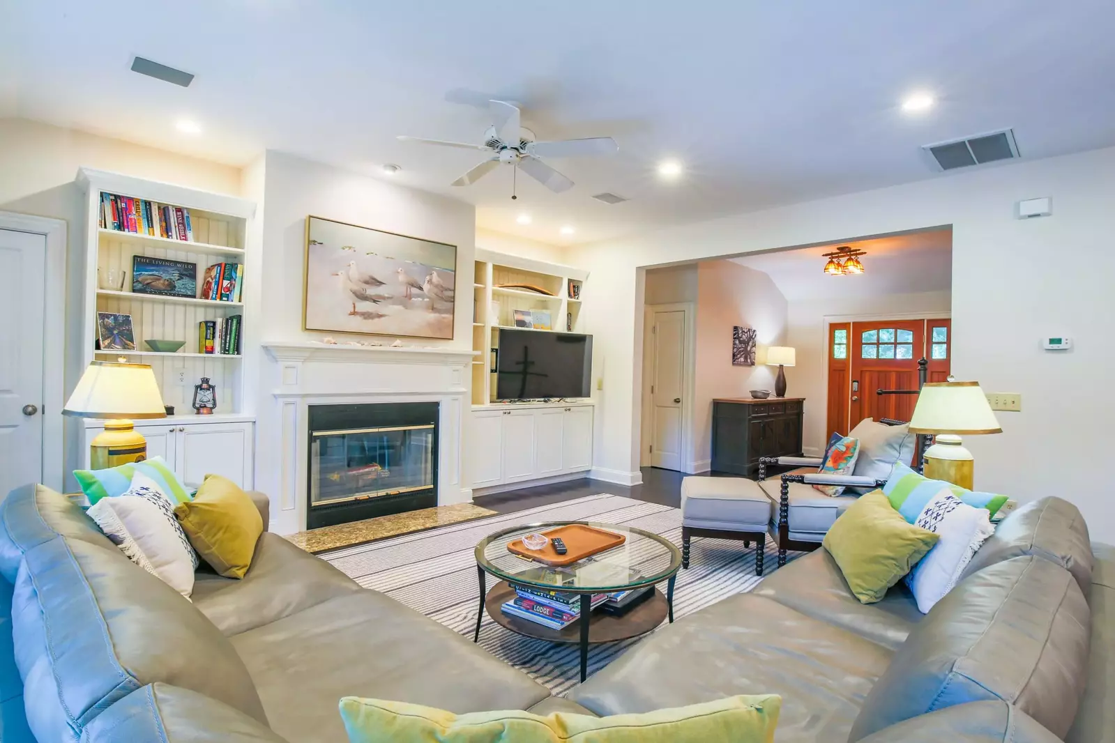 When you enter the home, you'll find this spacious living room with sectional seating and large screen TV.