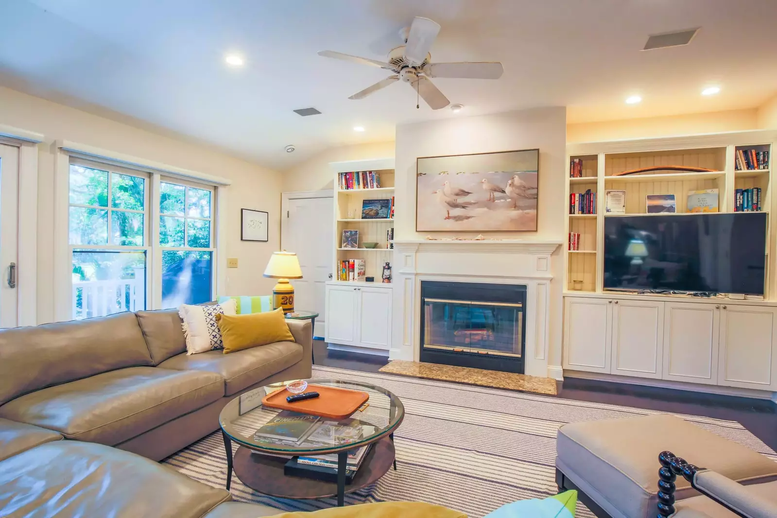 You can access the back porch through the sliding door in the living room.