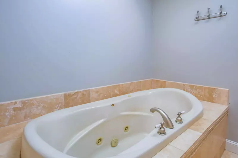 The en suite bathroom also features this soaking tub.