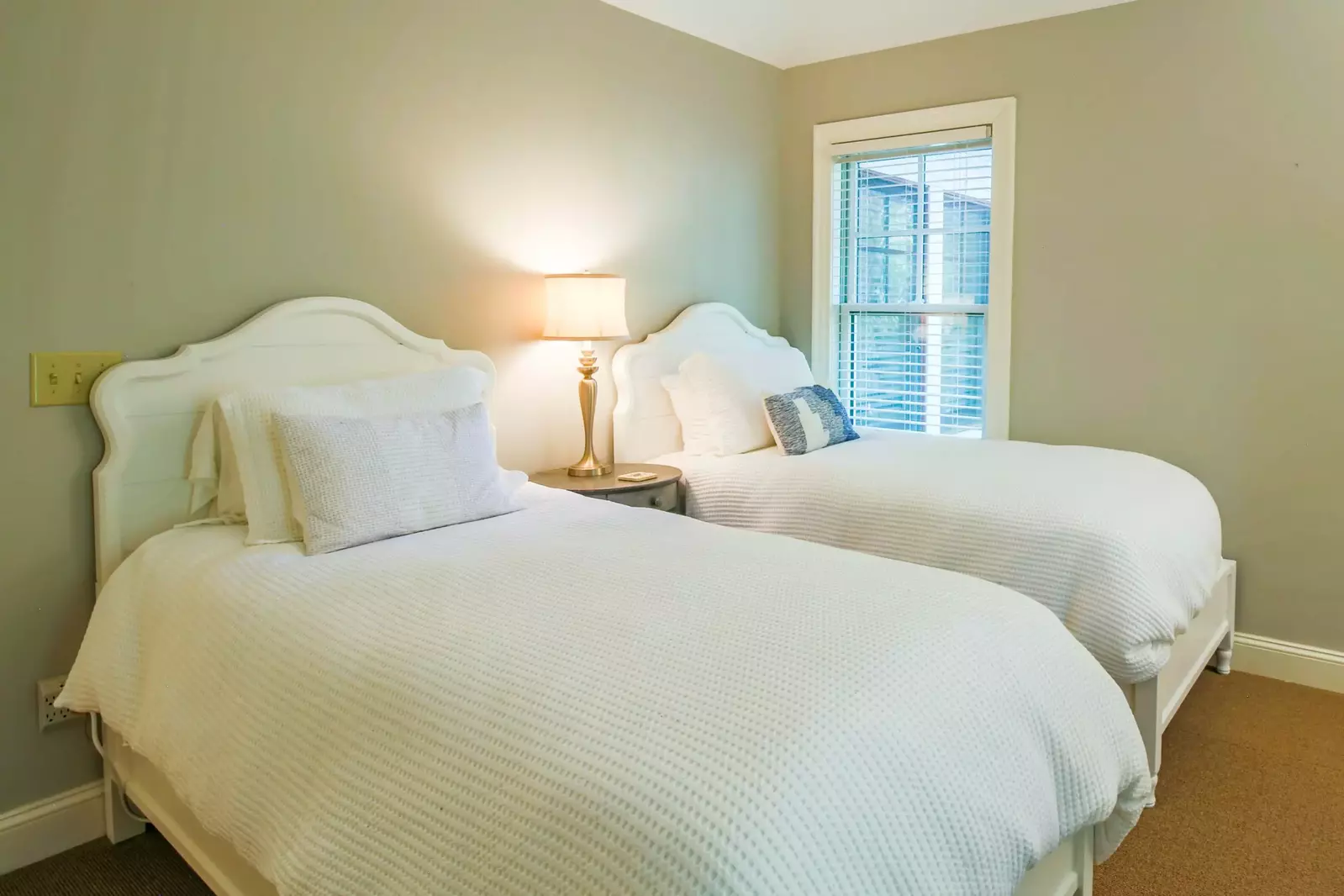 The home's fifth bedroom features two twin beds.
