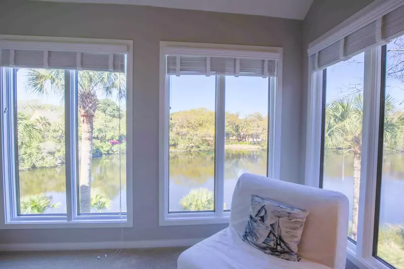 The master suite also features stunning views of the lagoon behind the home.