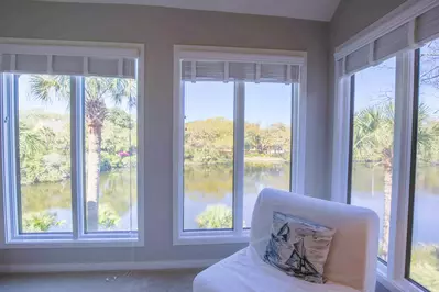 The master suite also features stunning views of the lagoon behind the home.