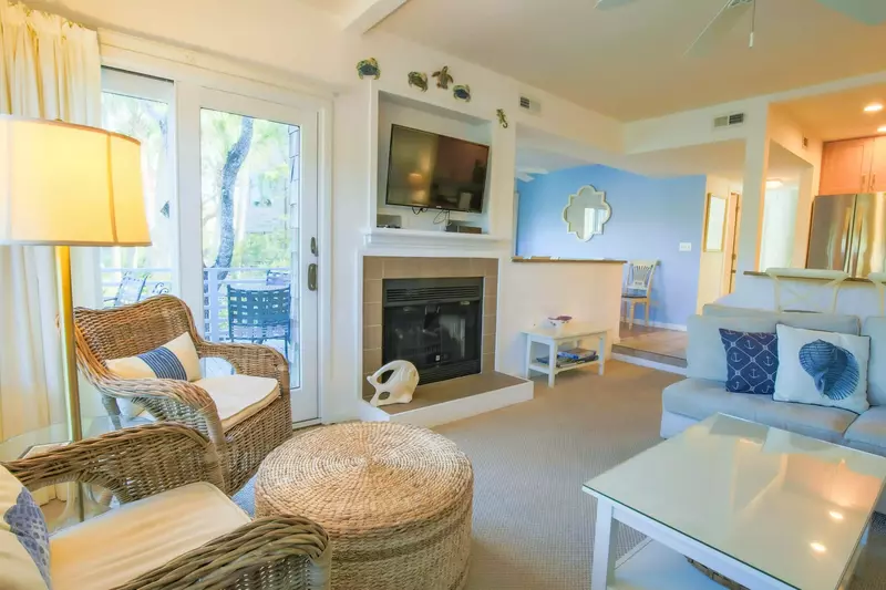 The living room also has a wall-mounted cable TV.