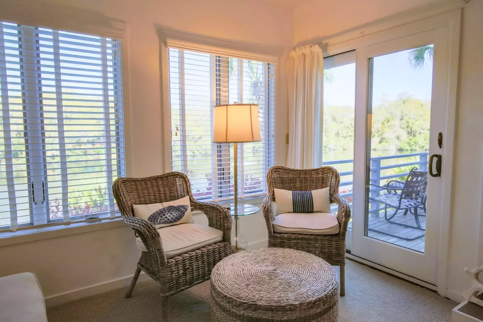 The living room features lagoon views and sliding door access to the back porch.