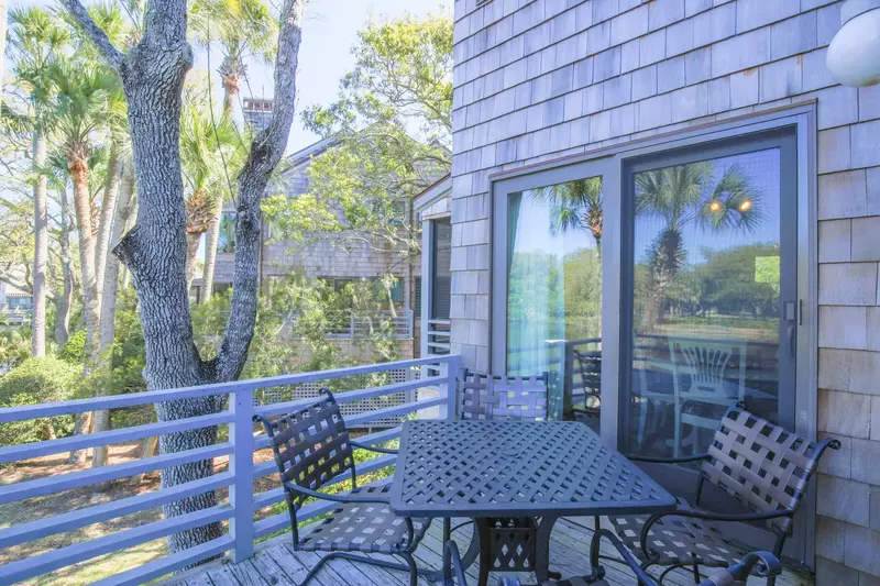 There's an outdoor dining table on the back porch that seats 4.