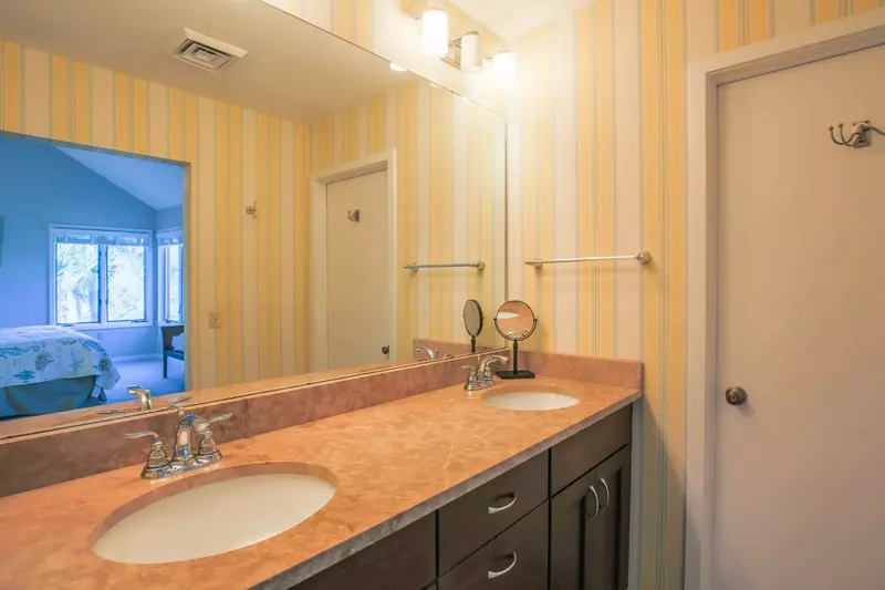 The master bathroom has a spacious, double sink vanity.