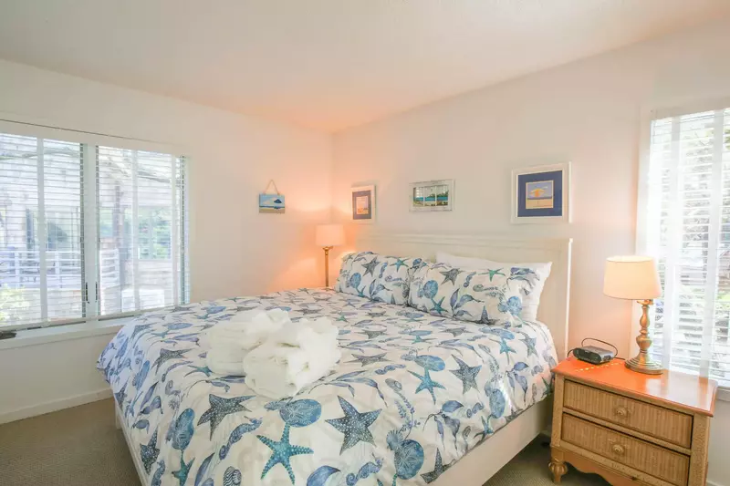 This guest bedroom, which is located on the home's lower level, features a king bed.
