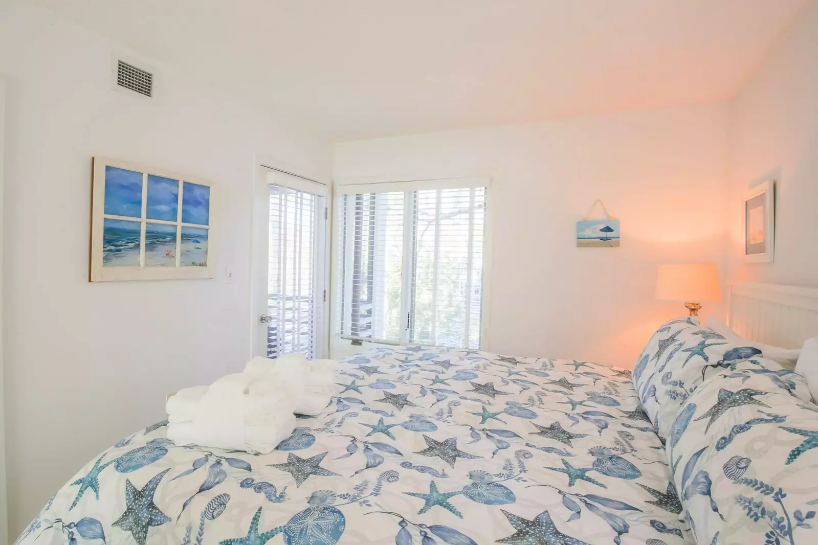 This bedroom also has access to the screened porch.