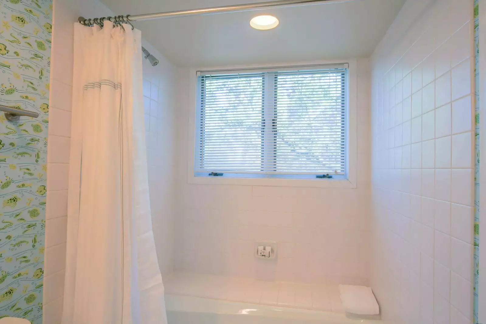 There is a also a shower/tub combo within the en suite bathroom.