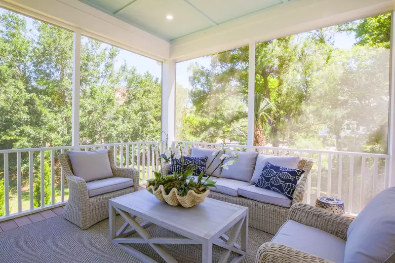 Whispering Palms features this wonderful screened porch.