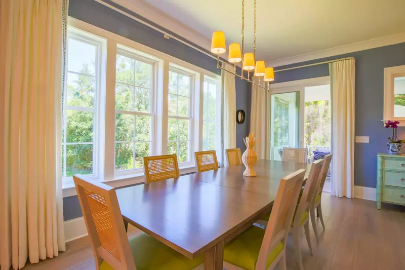 The sliding glass door in the dining area opens out onto a the screened porch.