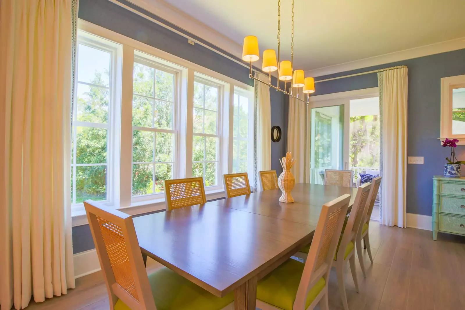 The sliding glass door in the dining area opens out onto a the screened porch.