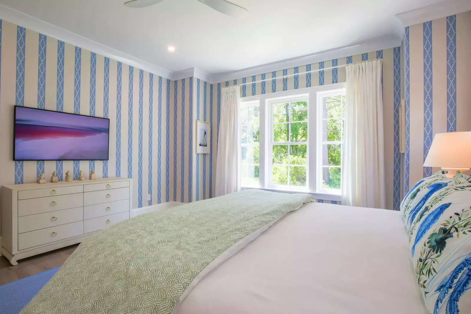 This suite also has a dresser and wall-mounted smart TV.