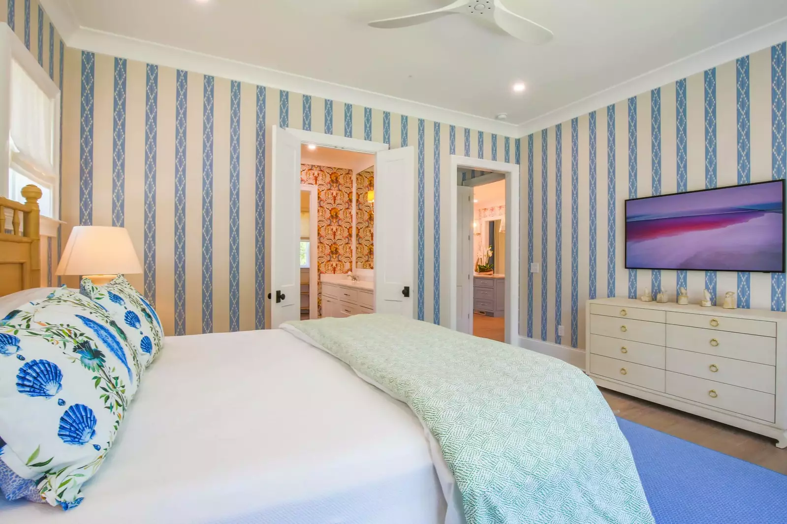 The double doors lead you to the en suite bathroom.