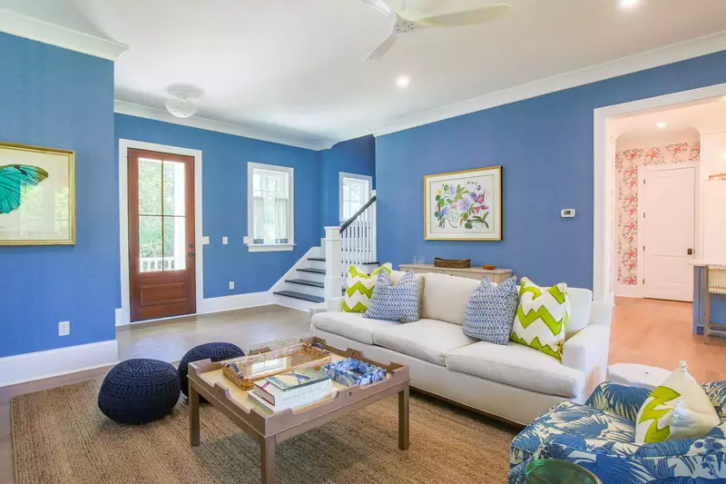 The staircase near the front door takes you to the three bedrooms and two bathrooms on the second floor.