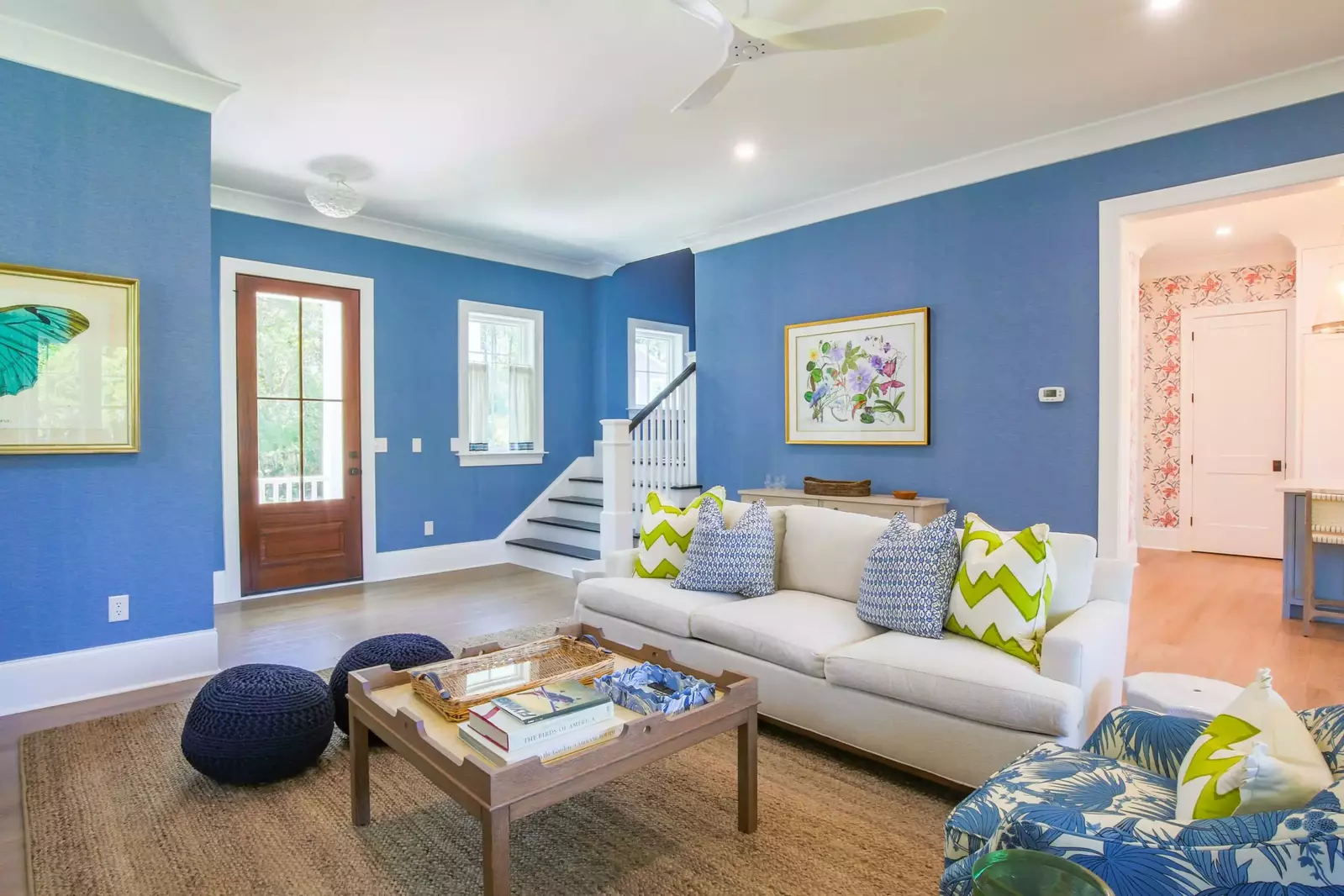The staircase near the front door takes you to the three bedrooms and two bathrooms on the second floor.