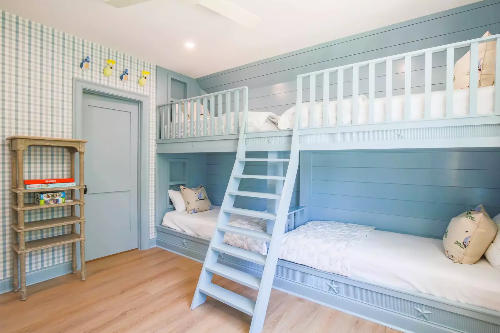 The bunk bedroom features four twin beds.