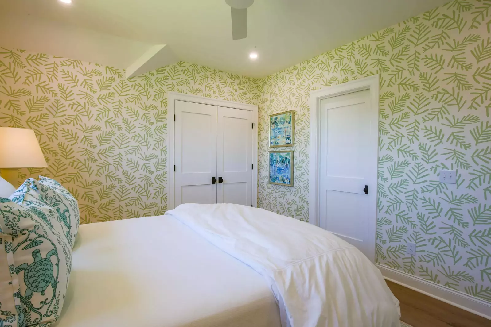 The double doors lead to the closet and the single door leads to the Jack & Jill bathroom.