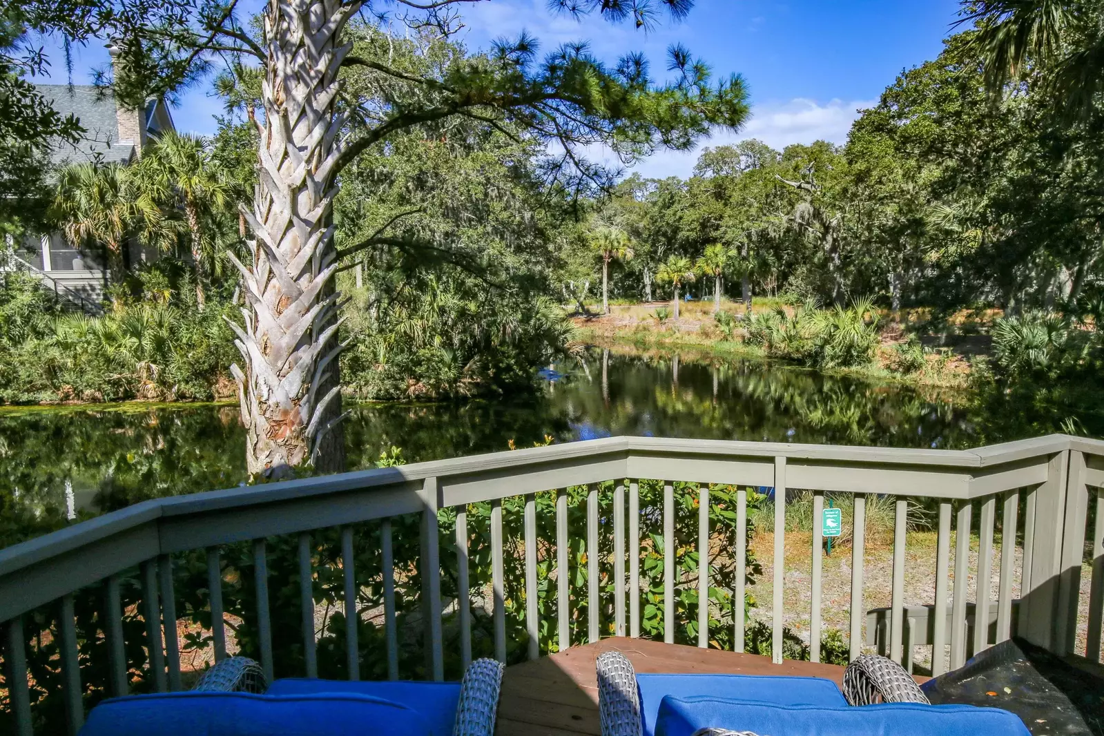 The rocking chairs on the back porch look out onto the lagoon.