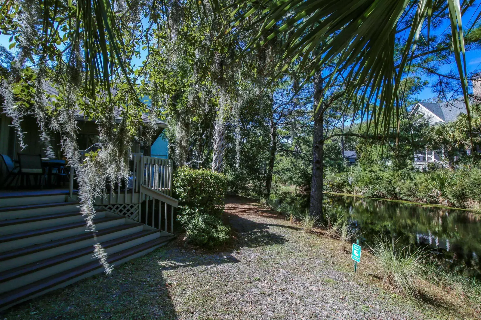 The lagoon is lined with palmetto trees and live oaks trees with Spanish moss.